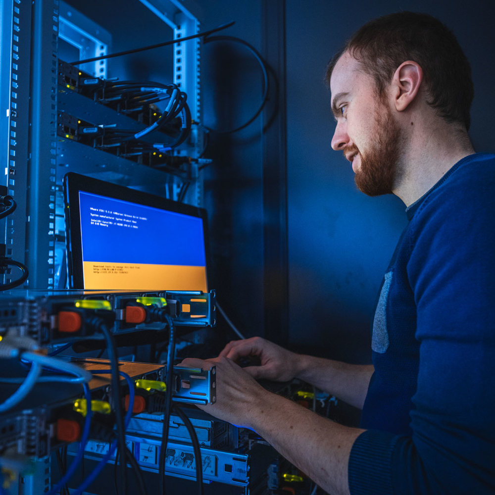 In the server room a It engineer ensures the proper functioning