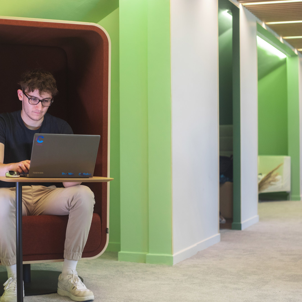 Attentive and hard-working young man in a pleasant relaxation area