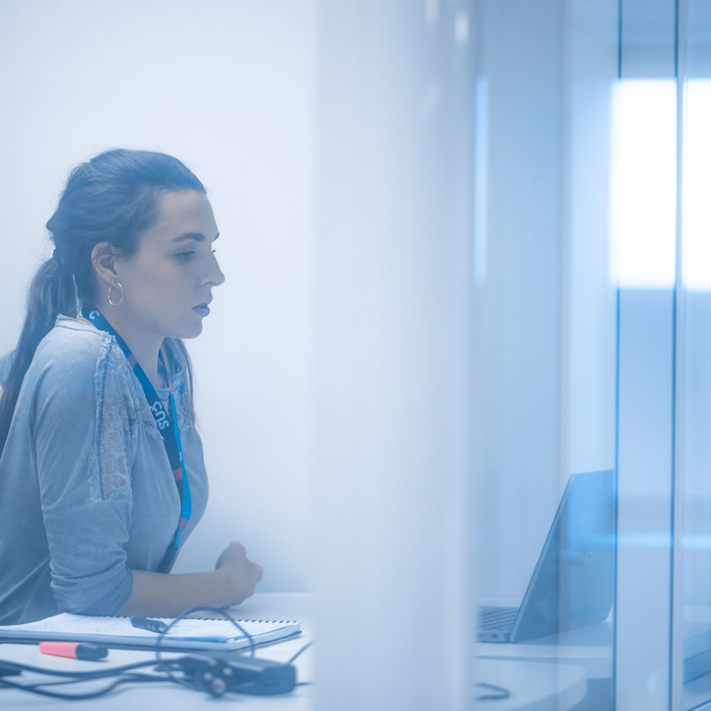 Businesswoman working alone in a meeting room.