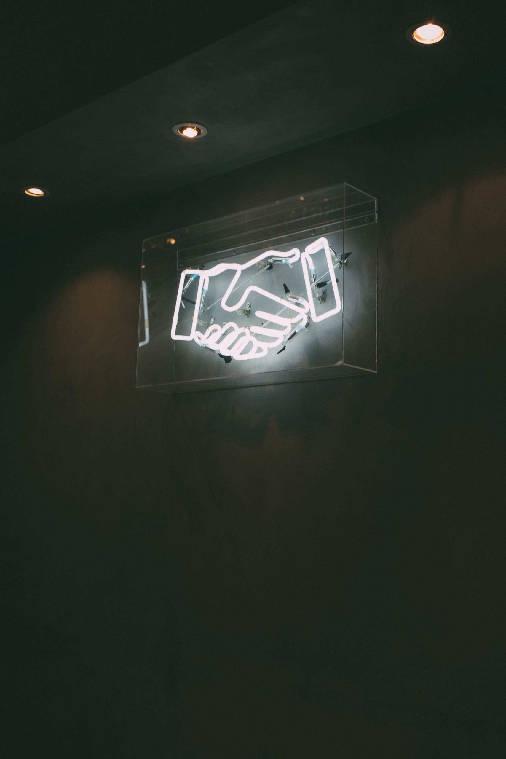 Neon white handshake